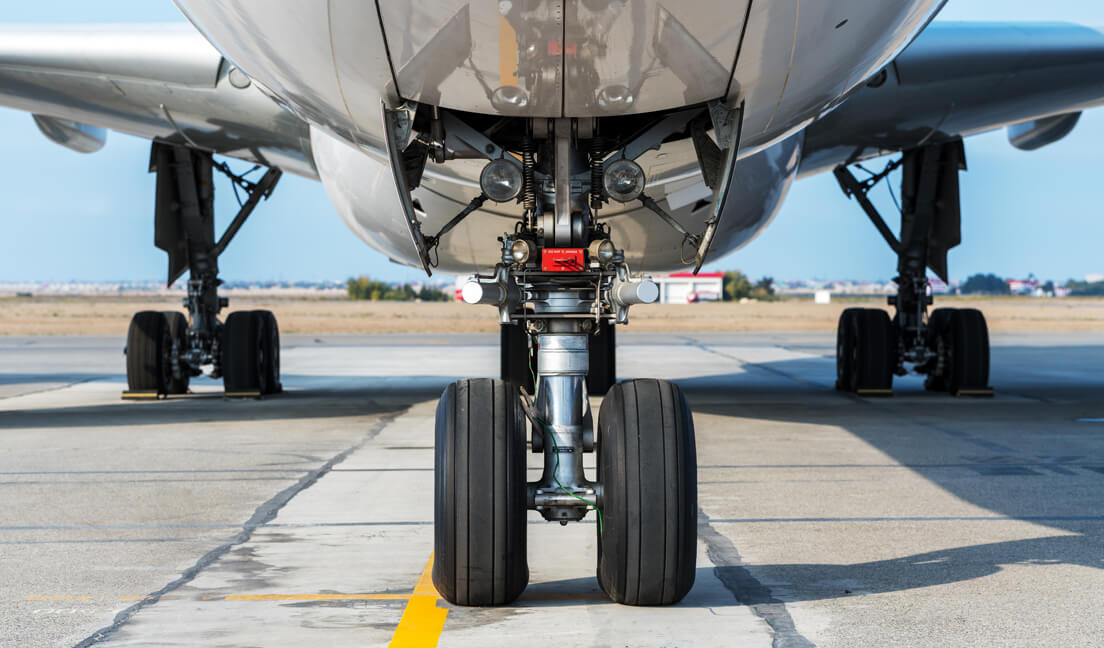 underside of a plane on a runway