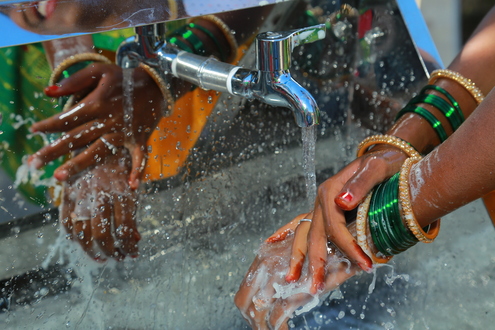 Girl washing her hands
